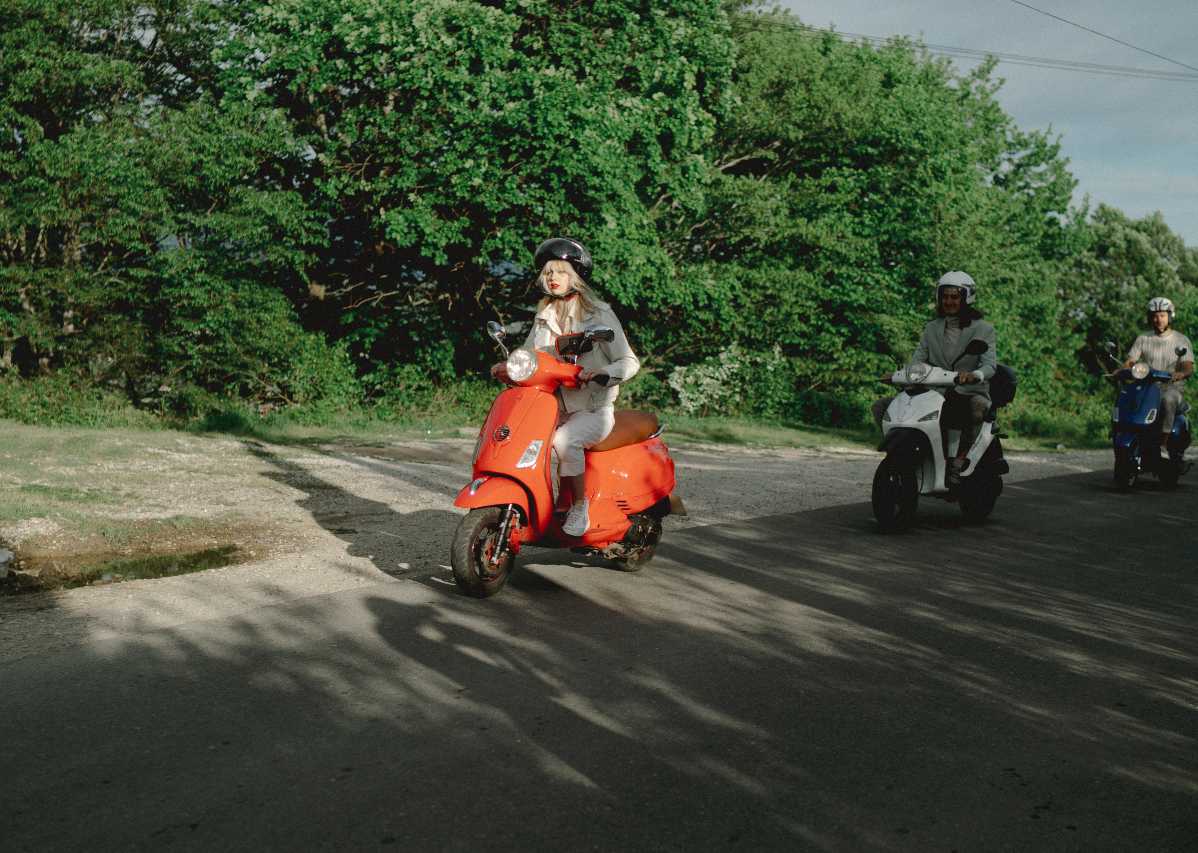 Picture of a group of people riding scooters together