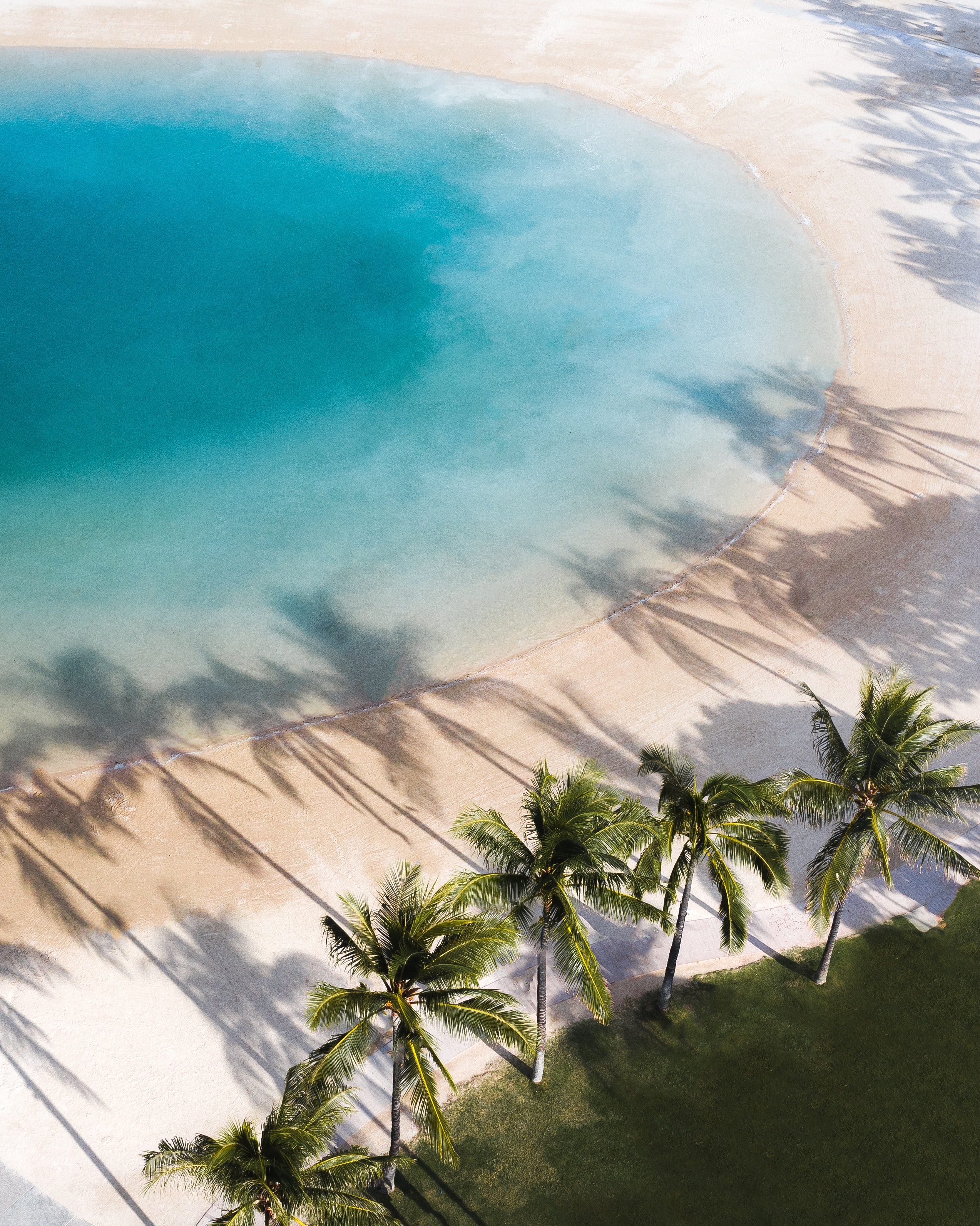 sandy beach with shallow blue water